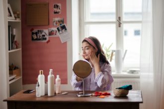 Teenage girl doing her skin care routine.